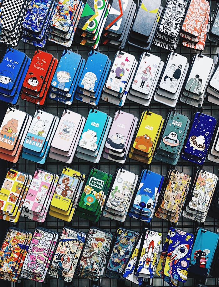 about-01 A colorful collection of various cartoon-themed phone cases arranged in rows, perfect for mobile accessory enthusiasts.